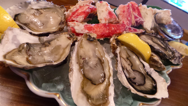 A plate of fresh oysters and super sweet hokkaido crab legs