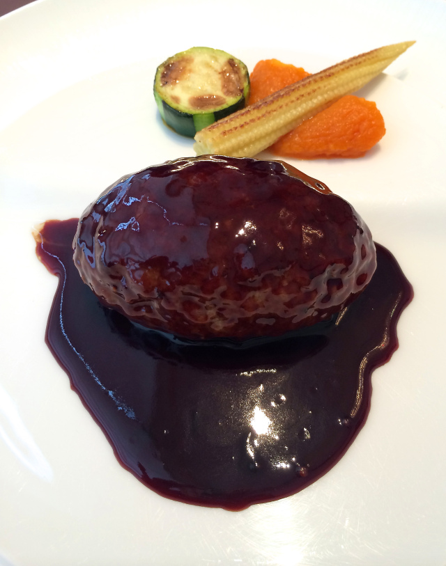 The hamburger with pieces of foie gras inside